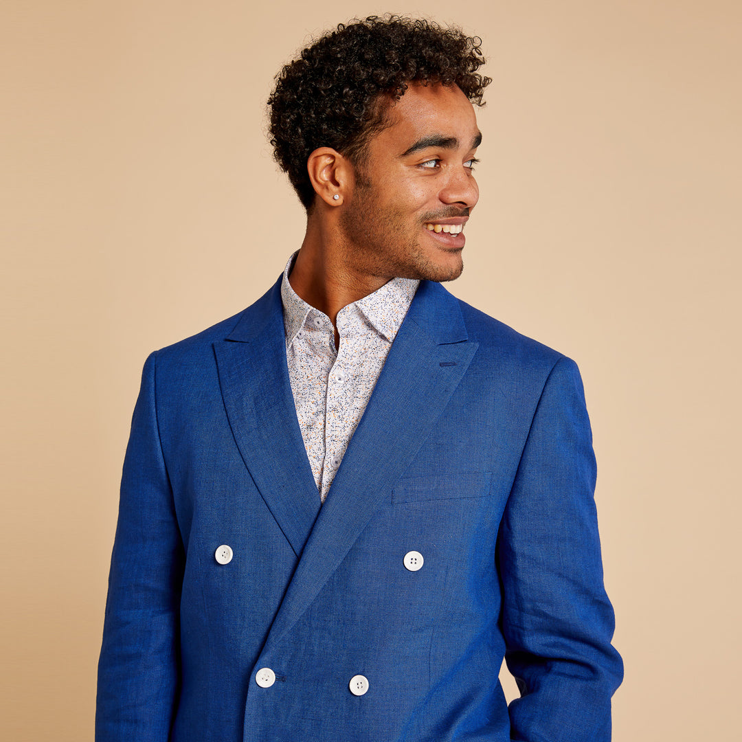 Close-up of the Inserch Classic DB Linen Blazers BL660 by Inserch, featuring beige woven fabric with a textured, slightly rough surface and visible weave pattern—ideal for a modern fit linen blazer. Available in 2 colors.
