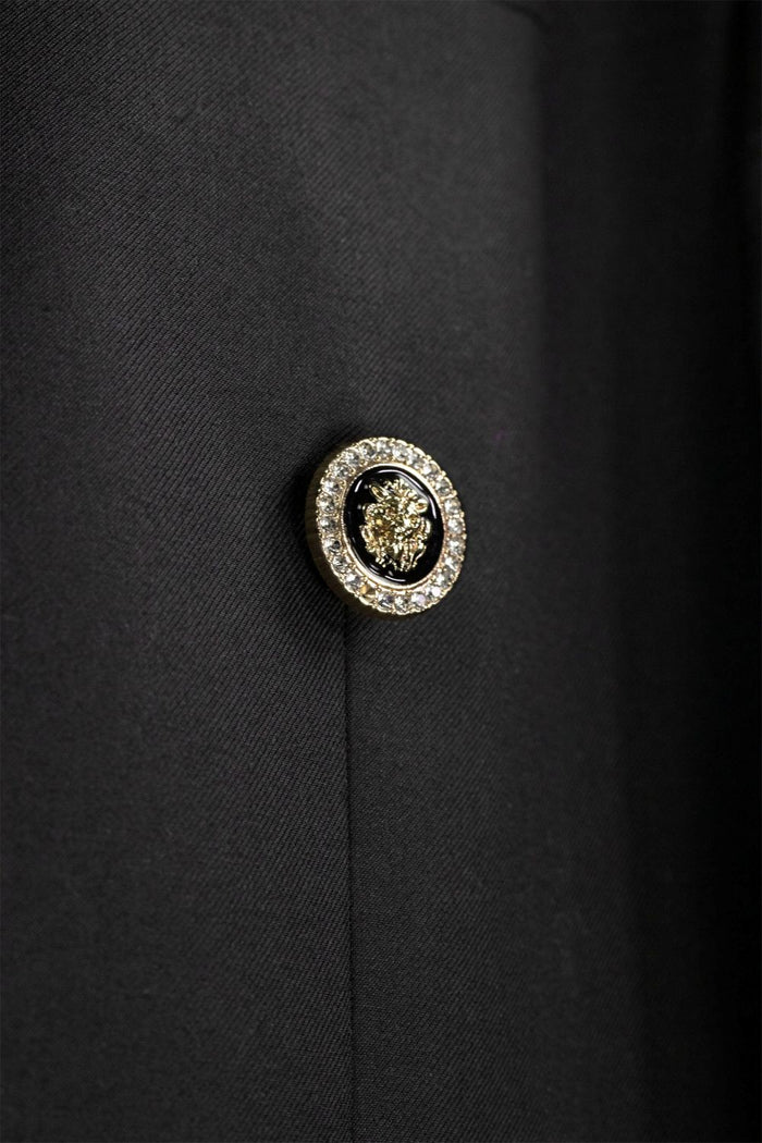 Modern Fit Black Double-Breasted Tuxedo Blazer BM-DB by Vinci Suits with satin lapels, gold buttons, teal shirt, black bow tie, and decorative lapel pin.