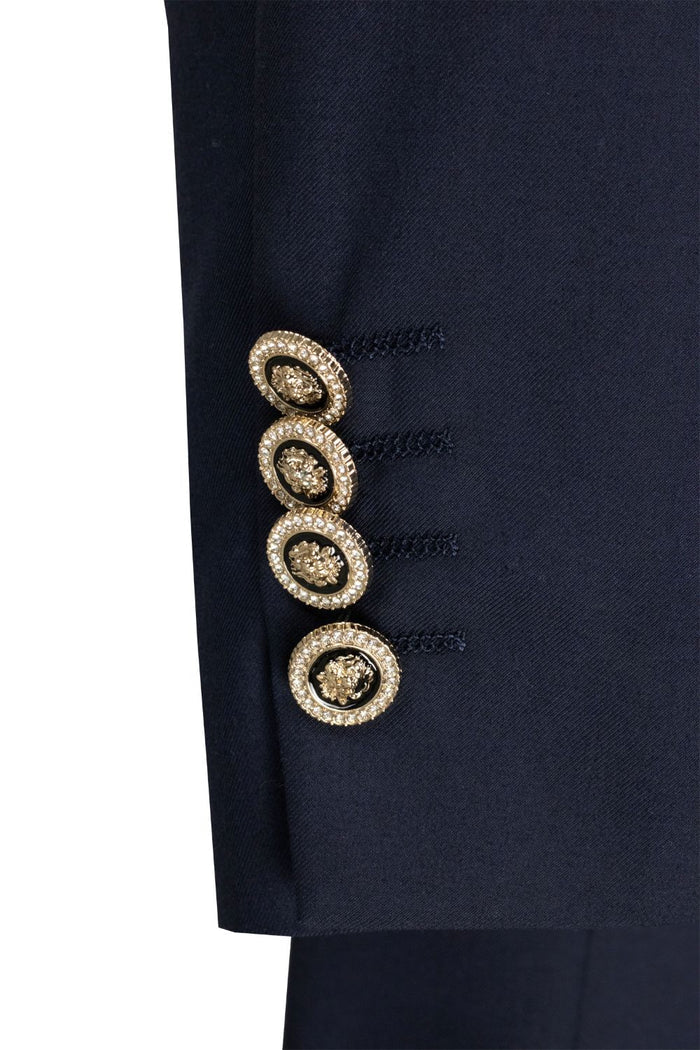 The mannequin wears the Modern Fit Navy Double-Breasted Tuxedo Blazer BM-DB by Vinci Suits, styled with a white dress shirt, black bow tie, and white pocket square.