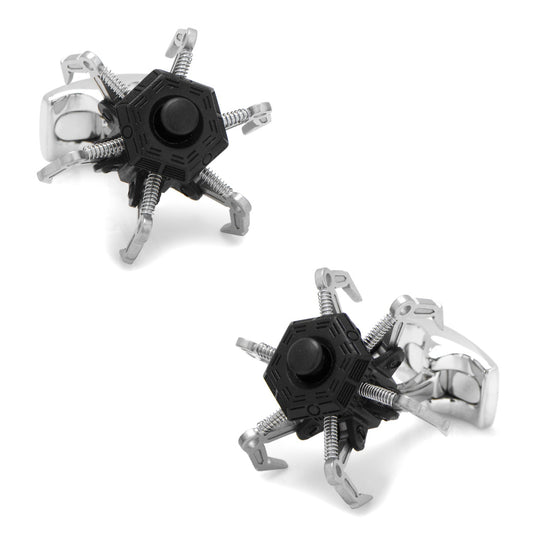 The Drone Cufflinks by Cufflinks.com are designed to resemble small black and silver spider robots with multiple claw-like legs.