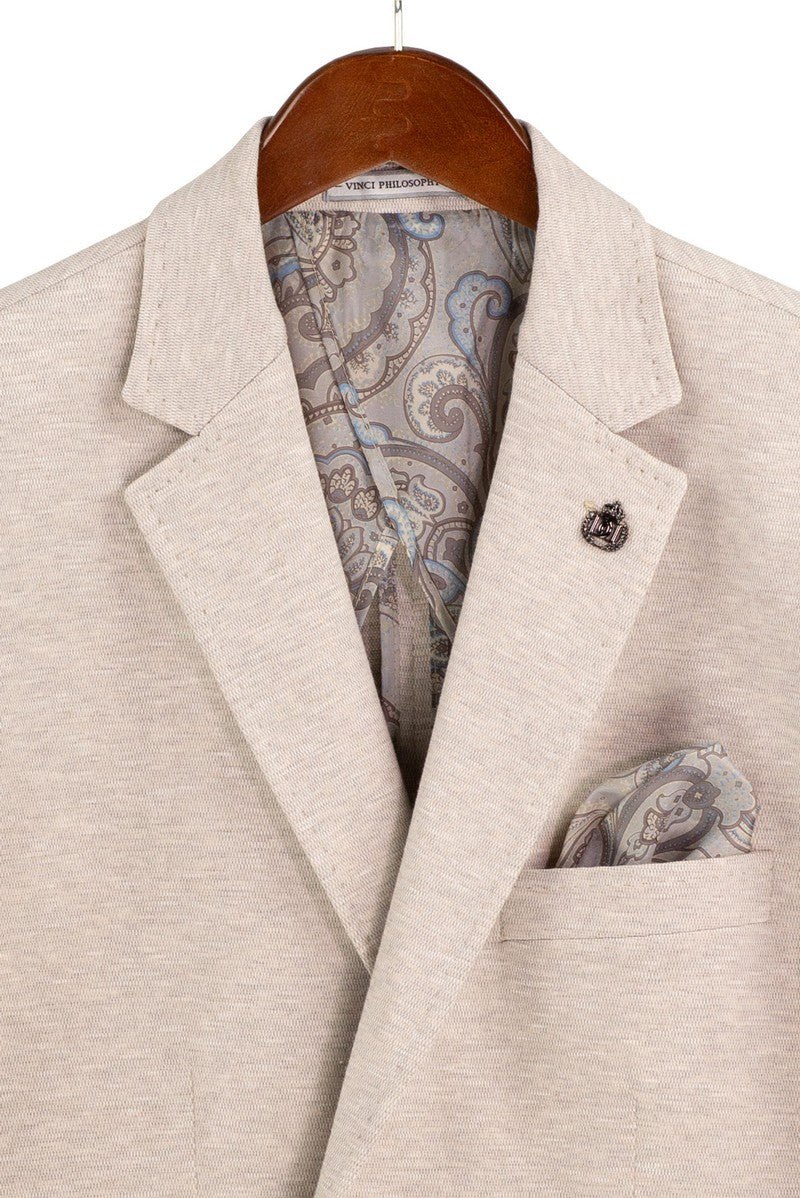 The mannequin wears the Vinci Suits Modern Fit Oatmeal Super Stretch Blazer BMK-2 with gold buttons, white shirt, gold tie, pocket square, and tan dress pants.