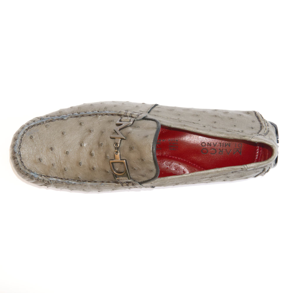A pair of Bolonia Gray luxury moccasin loafers by Marco Di Milano, featuring a light gray textured surface, metal buckle detail, and black rubber soles, displayed against a white background.