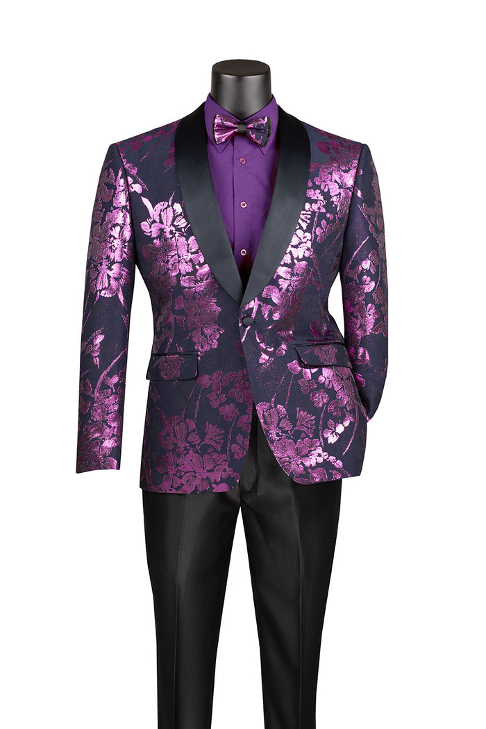The Slim Fit Fashion Jacket Shawl Lapel with Bow Tie Lavender BSF-19 by Vinci Suits features a purple floral tuxedo jacket with shawl lapels, black satin collar, matching purple shirt and bow tie, and black pants. This mannequin-displayed ensemble is wrinkle-resistant and stylish.