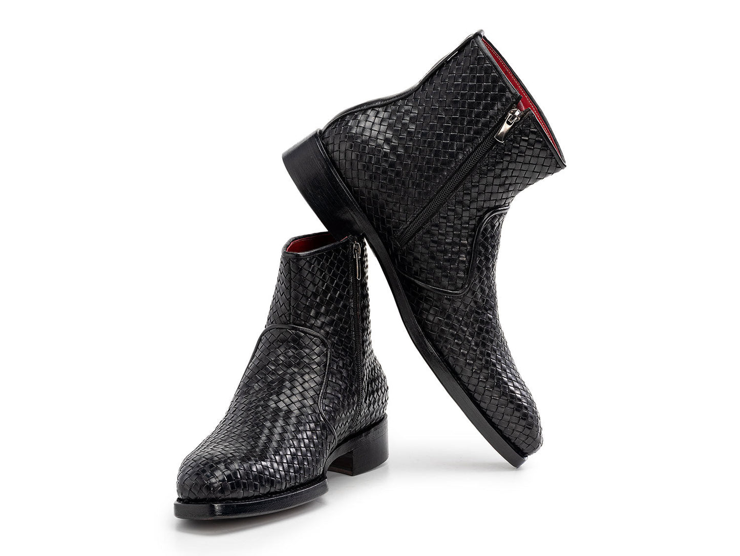 The Paul Parkman Black Woven Leather Goodyear Welted Zipper Boots (BT269BLK) for men are shown on a white background, one upright and the other resting against it.