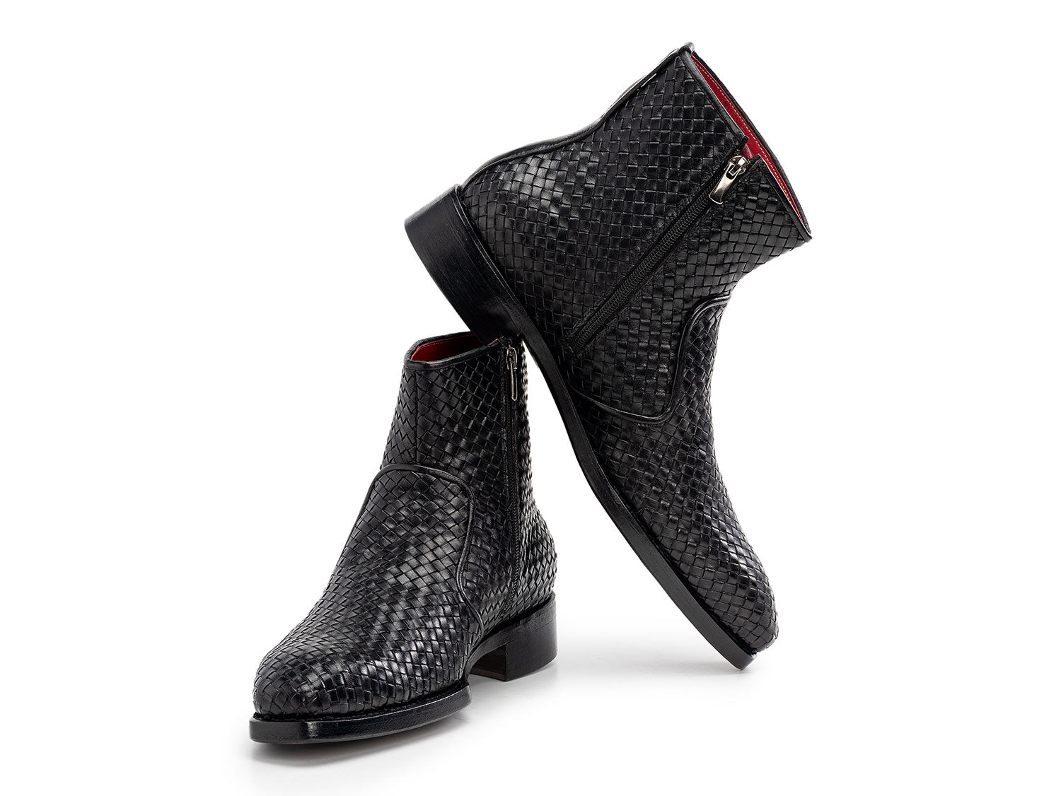 The Paul Parkman Black Woven Leather Goodyear Welted Zipper Boots (BT269BLK) for men are shown on a white background, one upright and the other resting against it.