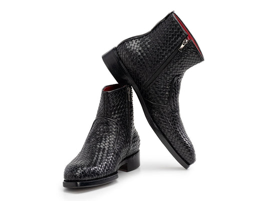 The Paul Parkman Black Woven Leather Goodyear Welted Zipper Boots (BT269BLK) for men are shown on a white background, one upright and the other resting against it.