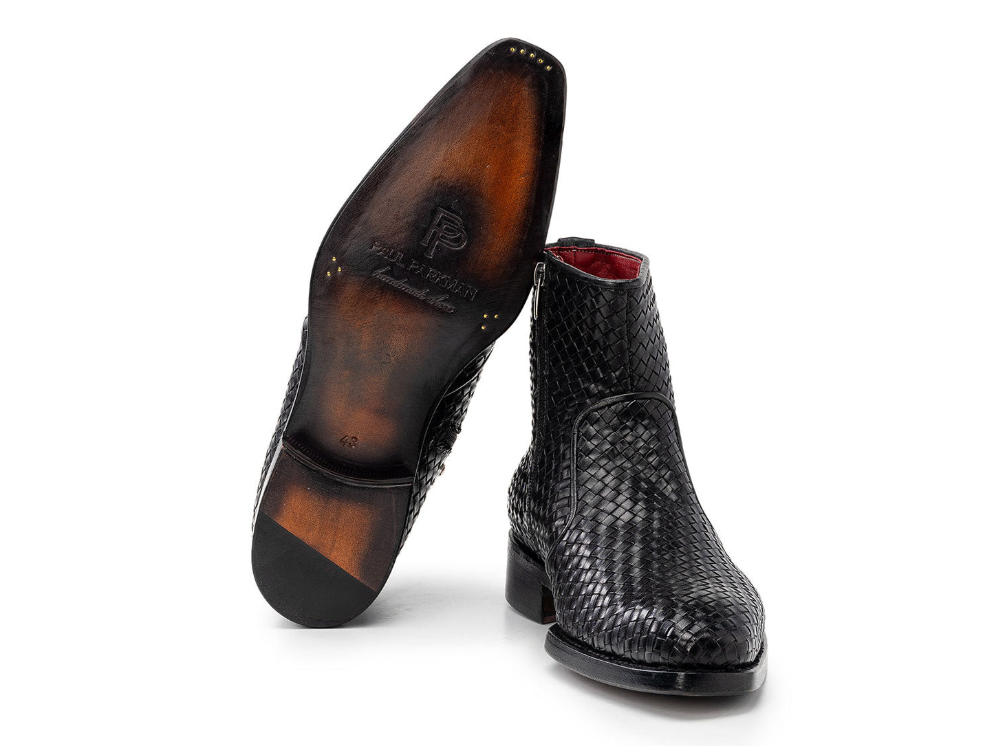 The Paul Parkman Black Woven Leather Goodyear Welted Zipper Boots (BT269BLK) for men are shown on a white background, one upright and the other resting against it.