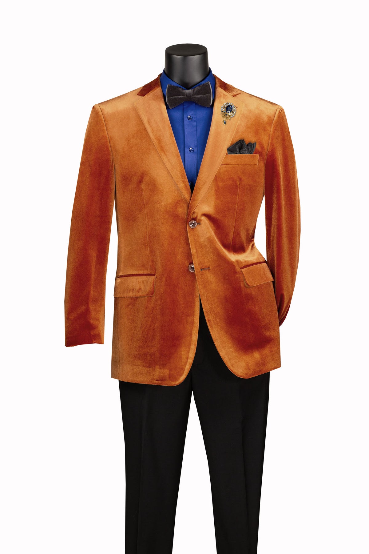 Mannequin wears Vinci Suits Velvet Regular Fit Fashion Jacket Rust B-27, blue shirt, black bow tie and pants, brooch, and pocket square against a white background.