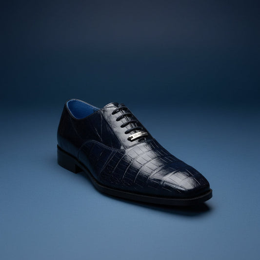 A Belvedere Shoe 8 in black, featuring a crocodile-patterned leather design with laces, is displayed on a wooden surface. Please note: this BELVEDERE shoe is clearance (Size 9 only) and is FINAL SALE—no returns or exchanges will be accepted.