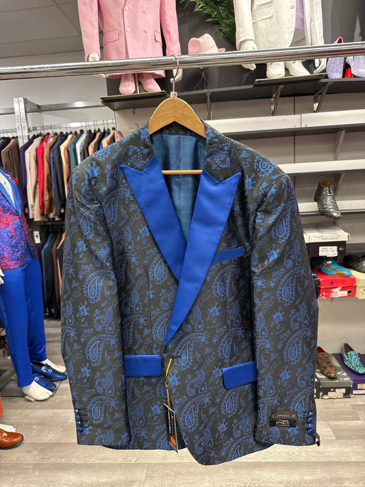 An EJ SAMUEL JACKET 27 CLEARANCE tuxedo jacket featuring a blue and black paisley pattern with blue lapels hangs on a wooden hanger in a clothing store; please note, this item is final sale with no exchanges or returns.