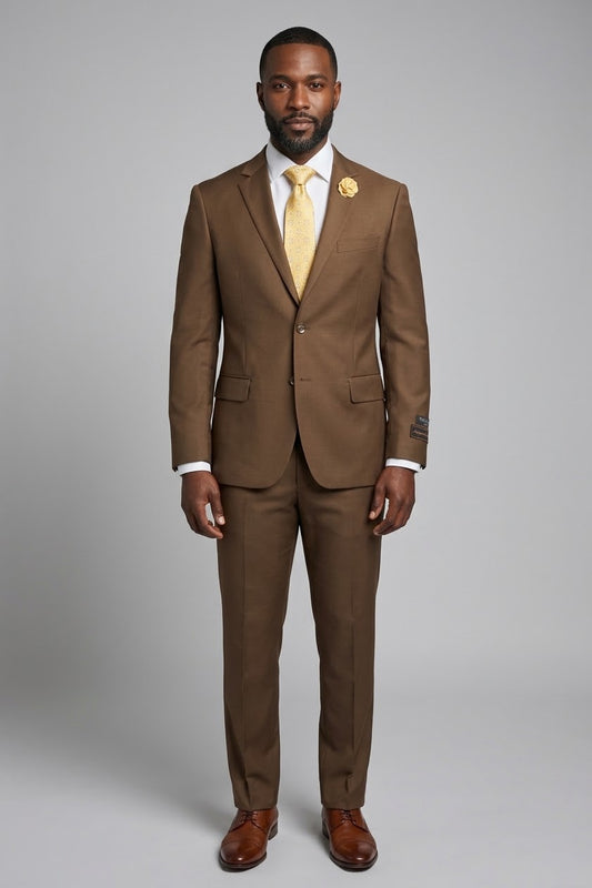 Displayed on a mannequin, the Tiglio Luxe Novello Tobacco Suit, crafted from Italian wool, is paired with a yellow patterned tie and matching lapel flower. This ensemble exemplifies the modern European fit that Tiglio suits are renowned for.