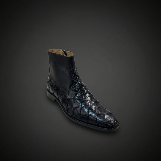 A single Belvedere Shoe 11 in black textured leather (Size 9 Only) by BELVEDERE is displayed on a wooden surface with folded clothing and shoes in the background. Please note: this clearance item is FINAL SALE and cannot be returned or exchanged.