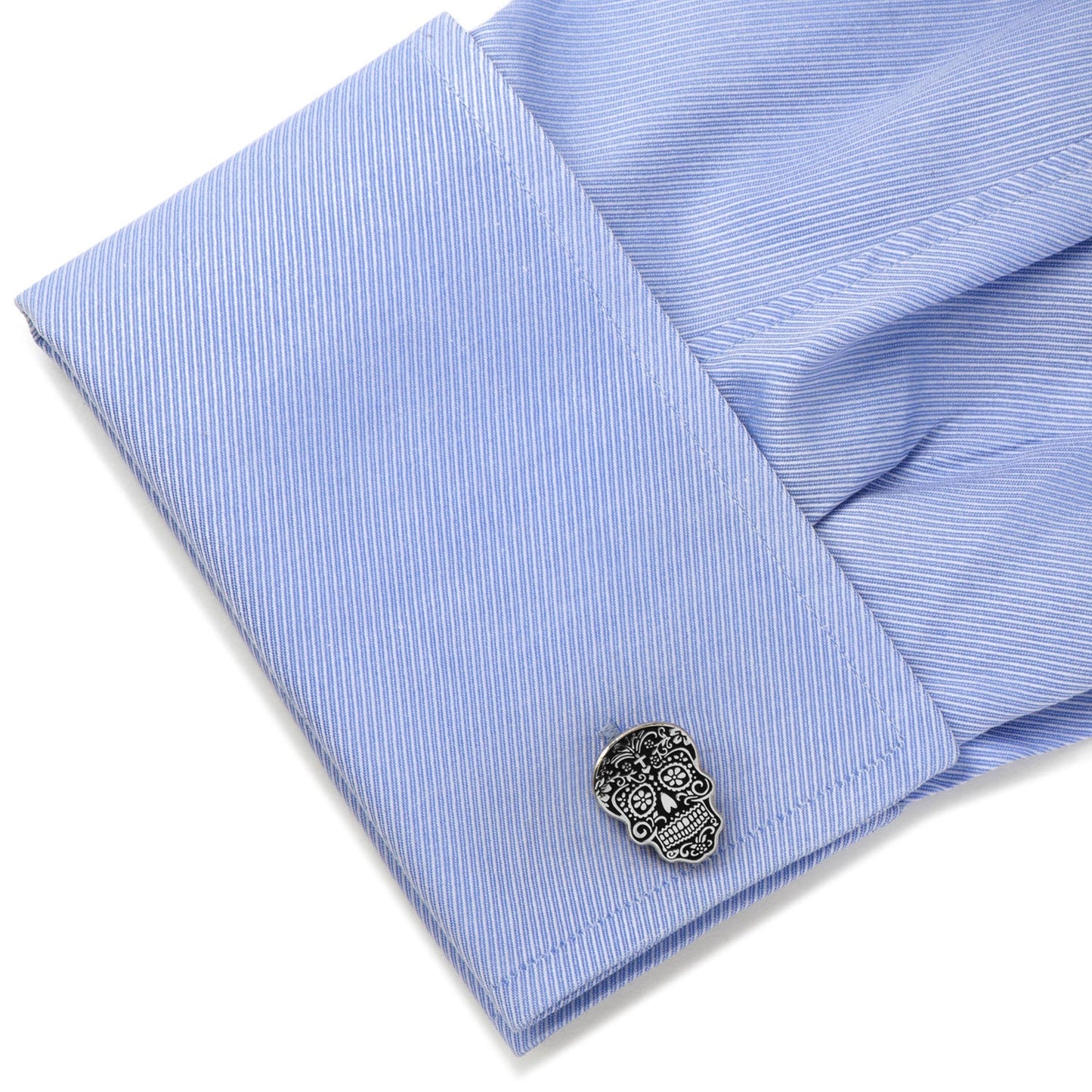 The Silver Day of the Dead Cufflinks from Cufflinks.com feature skull shapes with detailed black and white sugar skull designs, inspired by Día de los Muertos.