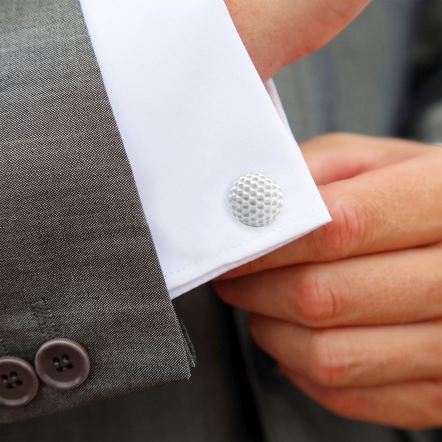 The Enamel Golf Ball Cufflinks by Cufflinks.com feature white, dimpled golf ball designs with silver-toned fastenings—an ideal gift for golfers on any occasion.