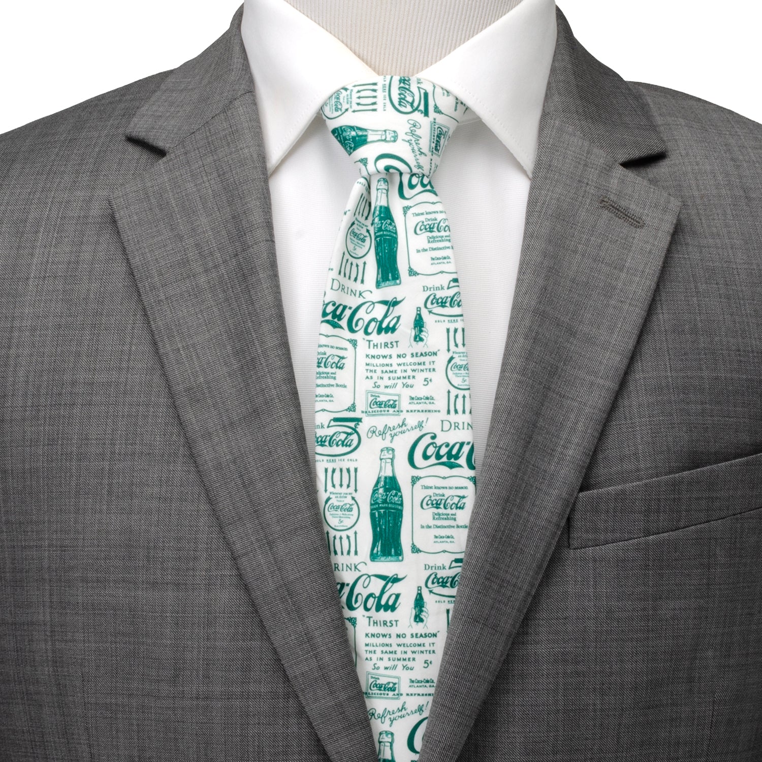 The Coca-Cola Green Bottle Men's Tie by Cufflinks.com features a white retro design with green vintage Coca-Cola ads and bottle illustrations printed across the fabric.