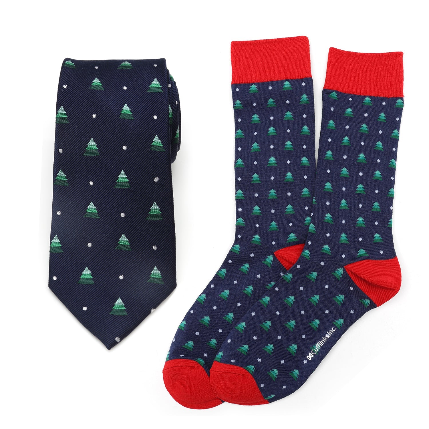 The Holiday Tree Tie and Sock Gift Set by Cufflinks.com includes a navy silk tie and matching socks with green Christmas trees, white dots, and festive red accents—making it a perfect holiday gift.