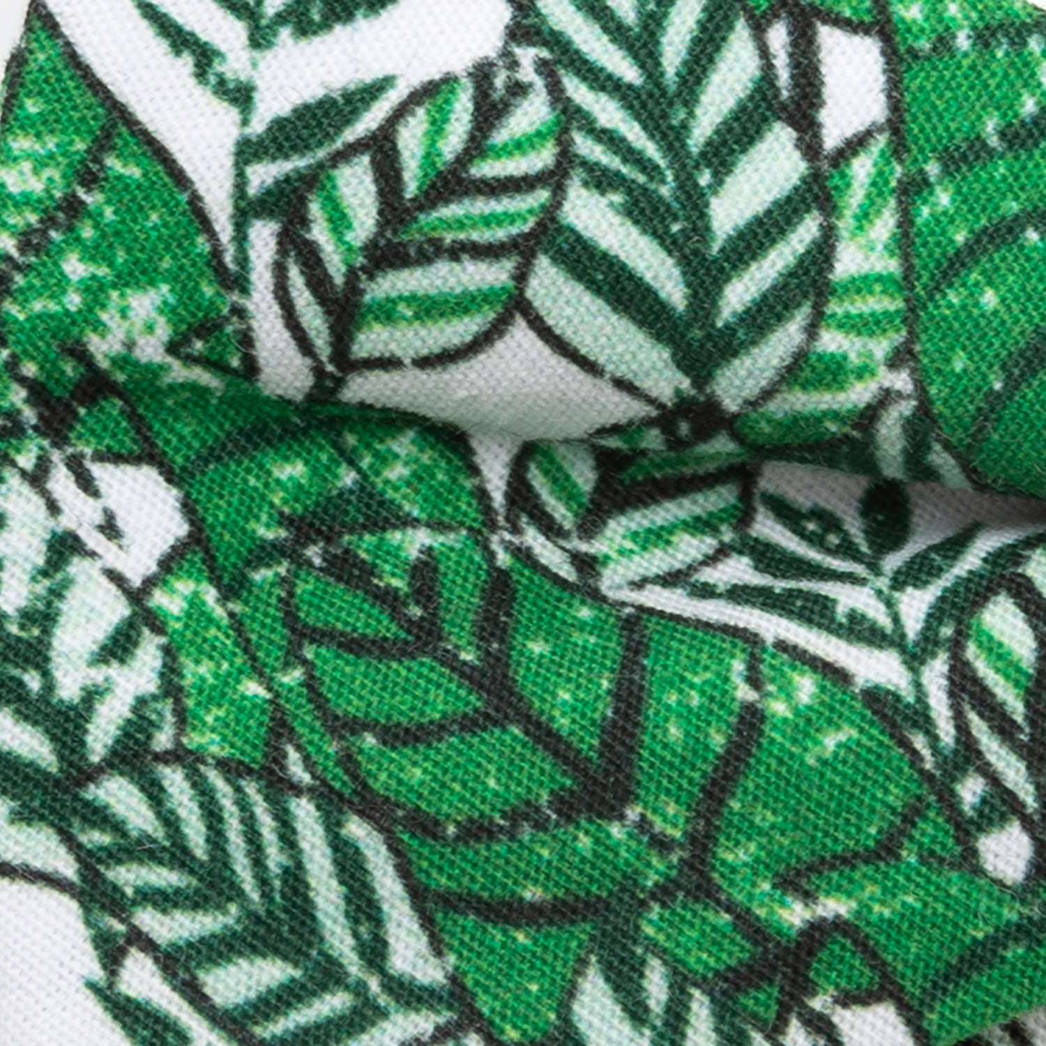 The Palm Leaf Men’s Bow Tie by Cufflinks.com features a green and white leaf pattern on cotton, pre-tied for convenience—perfect for beach weddings and shown against a plain white background.