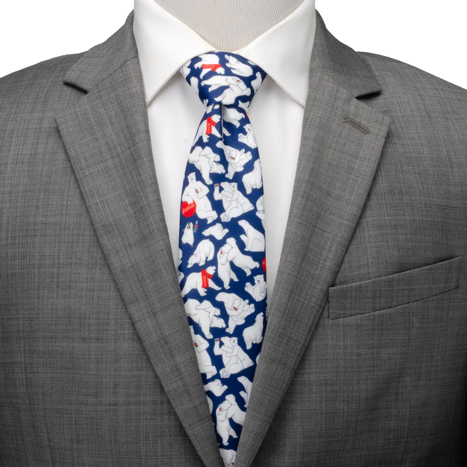 The Coca-Cola Polar Bear Navy Blue Men's Tie by Cufflinks.com features a festive pattern of white polar bears with red and white bottles—an ideal holiday accessory for fans of Coca-Cola.
