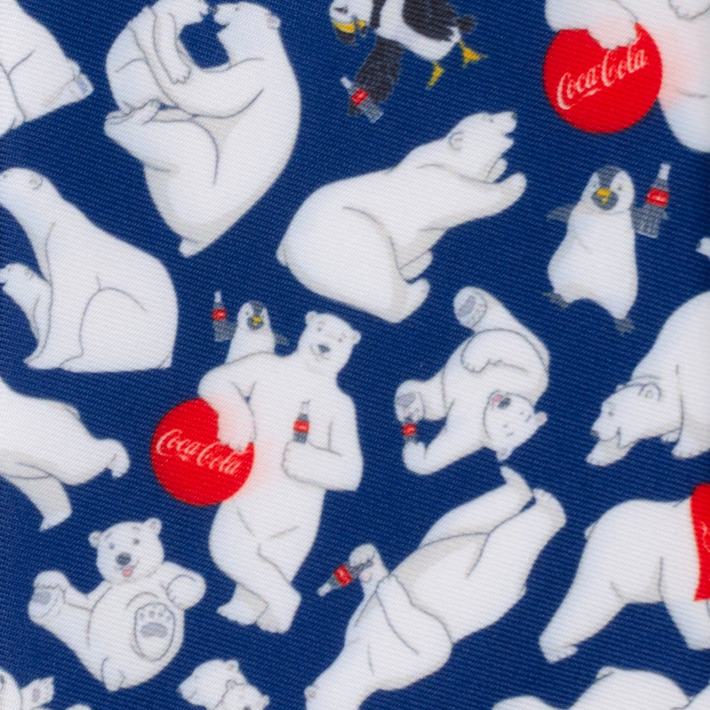 The Coca-Cola Polar Bear Navy Blue Men's Tie by Cufflinks.com features a festive pattern of white polar bears with red and white bottles—an ideal holiday accessory for fans of Coca-Cola.