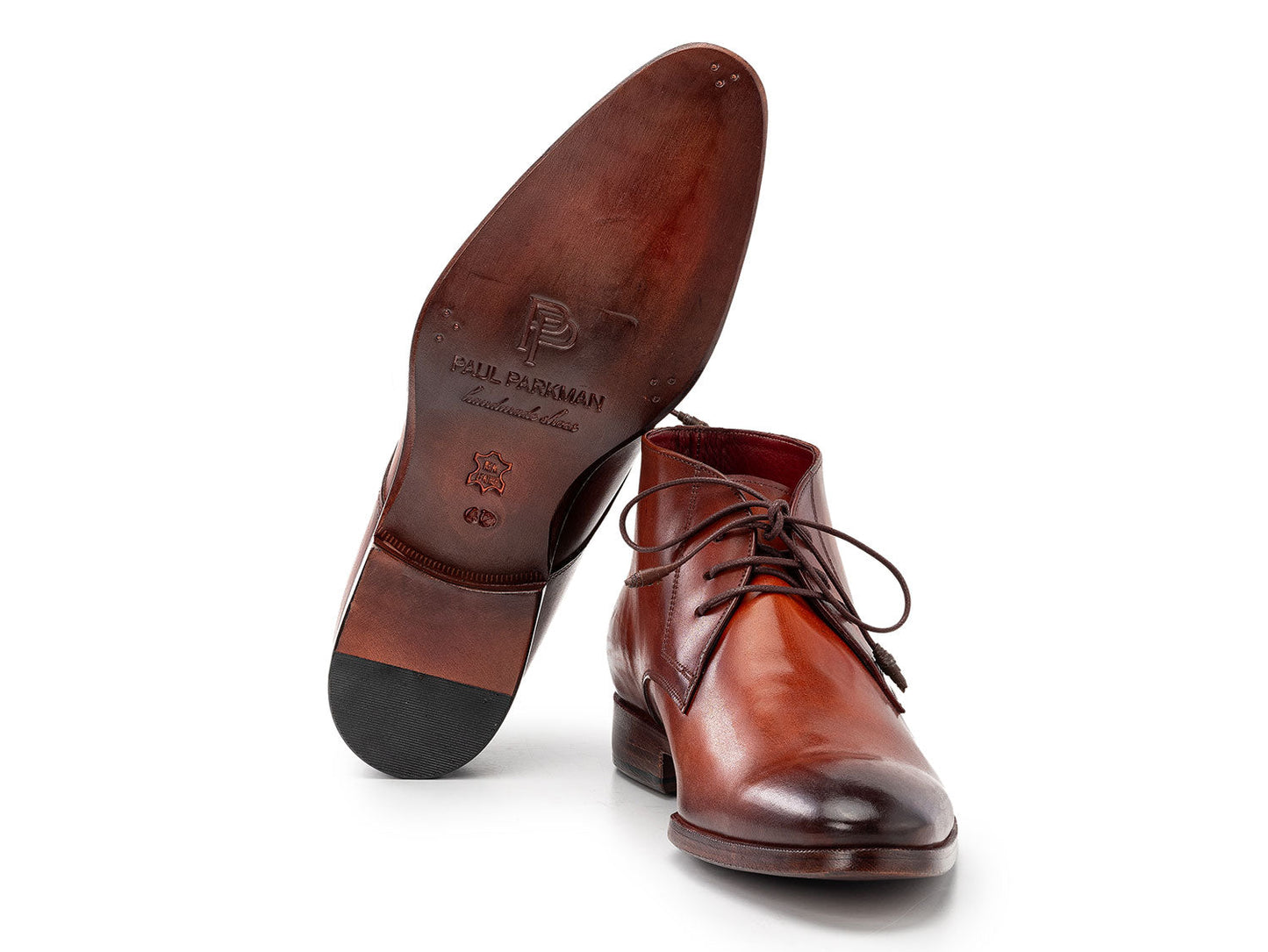 Paul Parkman Chukka Boots Camel & Brown - CK53BRW by Paul Parkman shown on a white background, with one boot upright and the other propped against it.