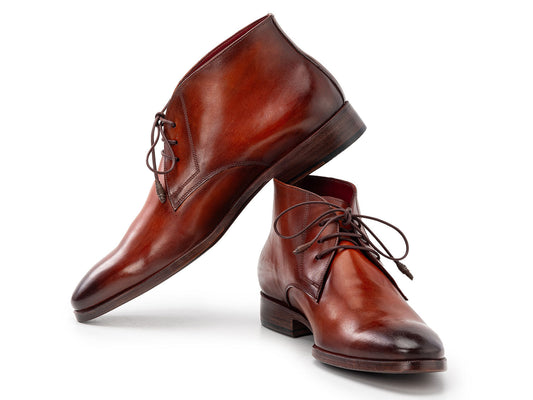 Paul Parkman Chukka Boots Camel & Brown - CK53BRW by Paul Parkman shown on a white background, with one boot upright and the other propped against it.
