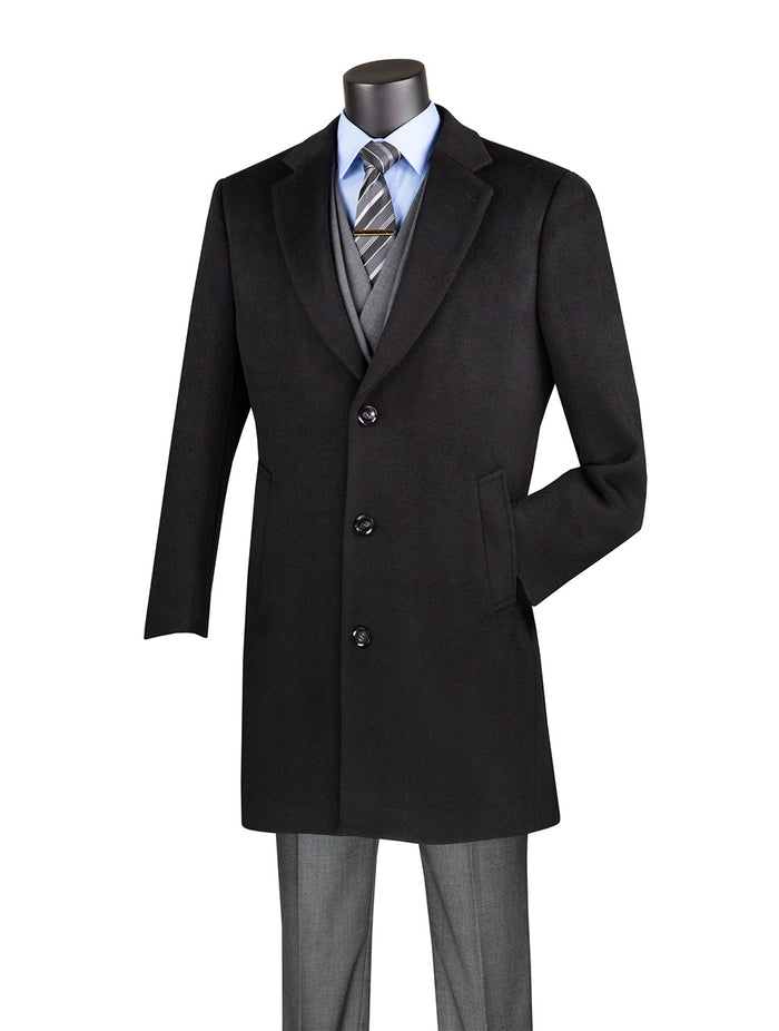 A mannequin elegantly showcases the Vinci Suits Wool & Cashmere Regular Fit Top Coat 38" Long in Black CL38, draped over a gray suit. A crisp blue shirt and striped tie complete the ensemble, capturing timeless sophistication and regular fit elegance.