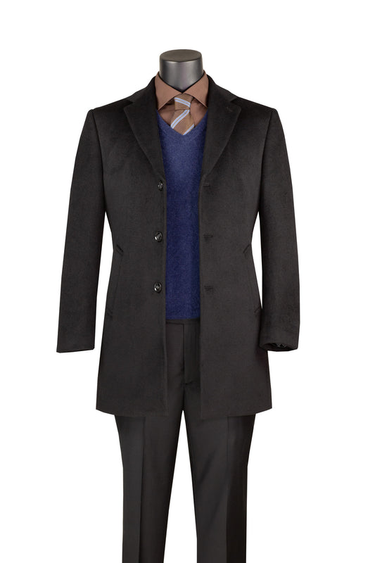 Mannequin wears Vinci Suits 34″ Black Winter Top Coat CM34, brown dress shirt, blue v-neck sweater, striped tie, and black dress pants on white background.