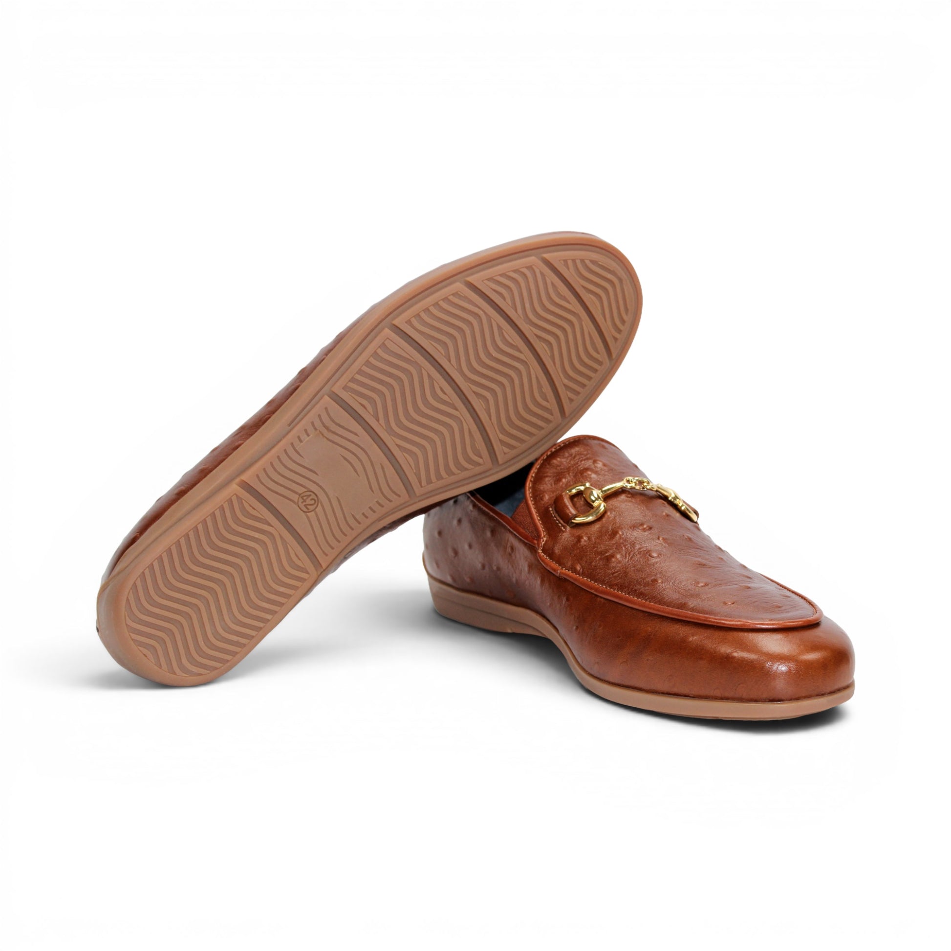 Duca Di Matiste's Duca Cortona Cuoio is a brown leather loafer featuring a gold metal bit detail and Stampa Struzzo ostrich-textured pattern, presented in a side profile against a white background—a refined showcase of luxury Italian footwear.