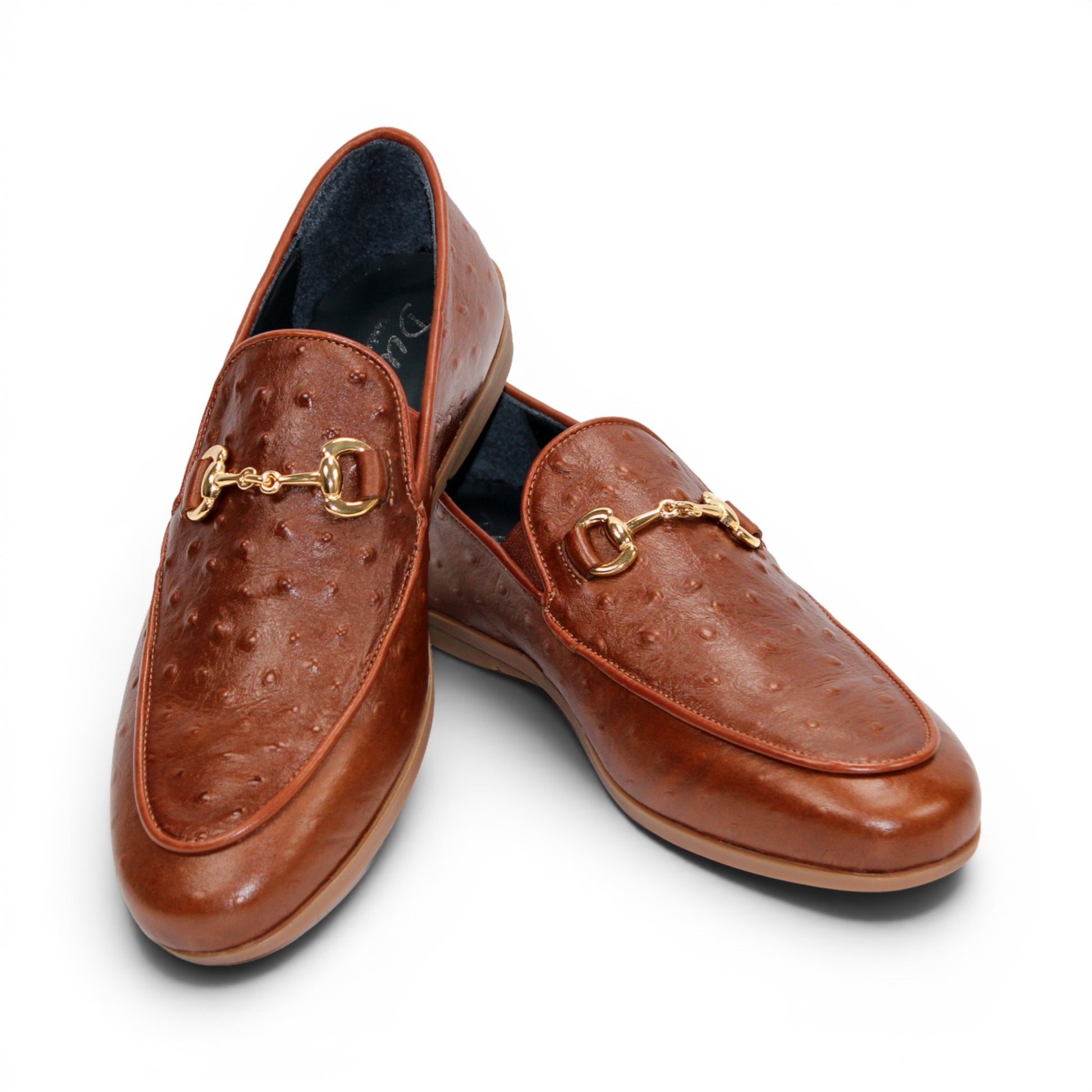 Duca Di Matiste's Duca Cortona Cuoio is a brown leather loafer featuring a gold metal bit detail and Stampa Struzzo ostrich-textured pattern, presented in a side profile against a white background—a refined showcase of luxury Italian footwear.