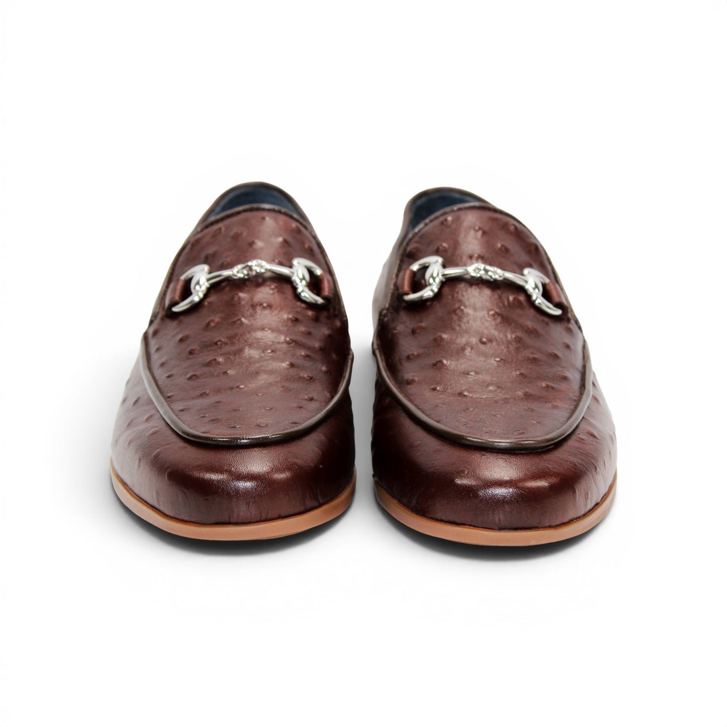 The Duca Di Matiste Duca Cortona Marrone features a luxurious brown leather loafer design with a textured Stampa Struzzo ostrich pattern, an elegant decorative metal bit on the upper, and a tan rubber sole. Displayed on a white background, this shoe exemplifies the finest Italian craftsmanship in men's luxury leather footwear.