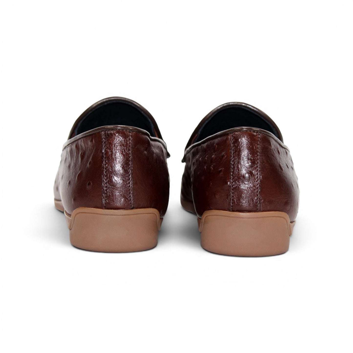The Duca Di Matiste Duca Cortona Marrone features a luxurious brown leather loafer design with a textured Stampa Struzzo ostrich pattern, an elegant decorative metal bit on the upper, and a tan rubber sole. Displayed on a white background, this shoe exemplifies the finest Italian craftsmanship in men's luxury leather footwear.