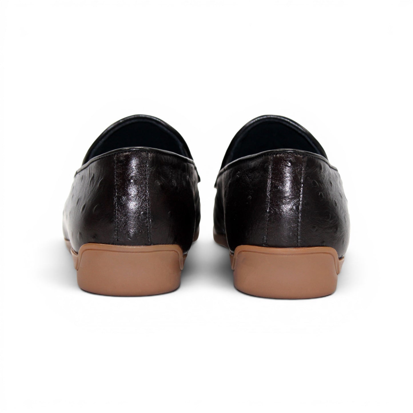 The Duca Cortona Black by Duca Di Matiste is a black Stampa Struzzo leather loafer, crafted in the style of a classic Italian shoe, featuring a silver buckle detail and a light brown rubber sole. Shown in profile on a white background, this refined design is an excellent choice for luxury footwear enthusiasts.