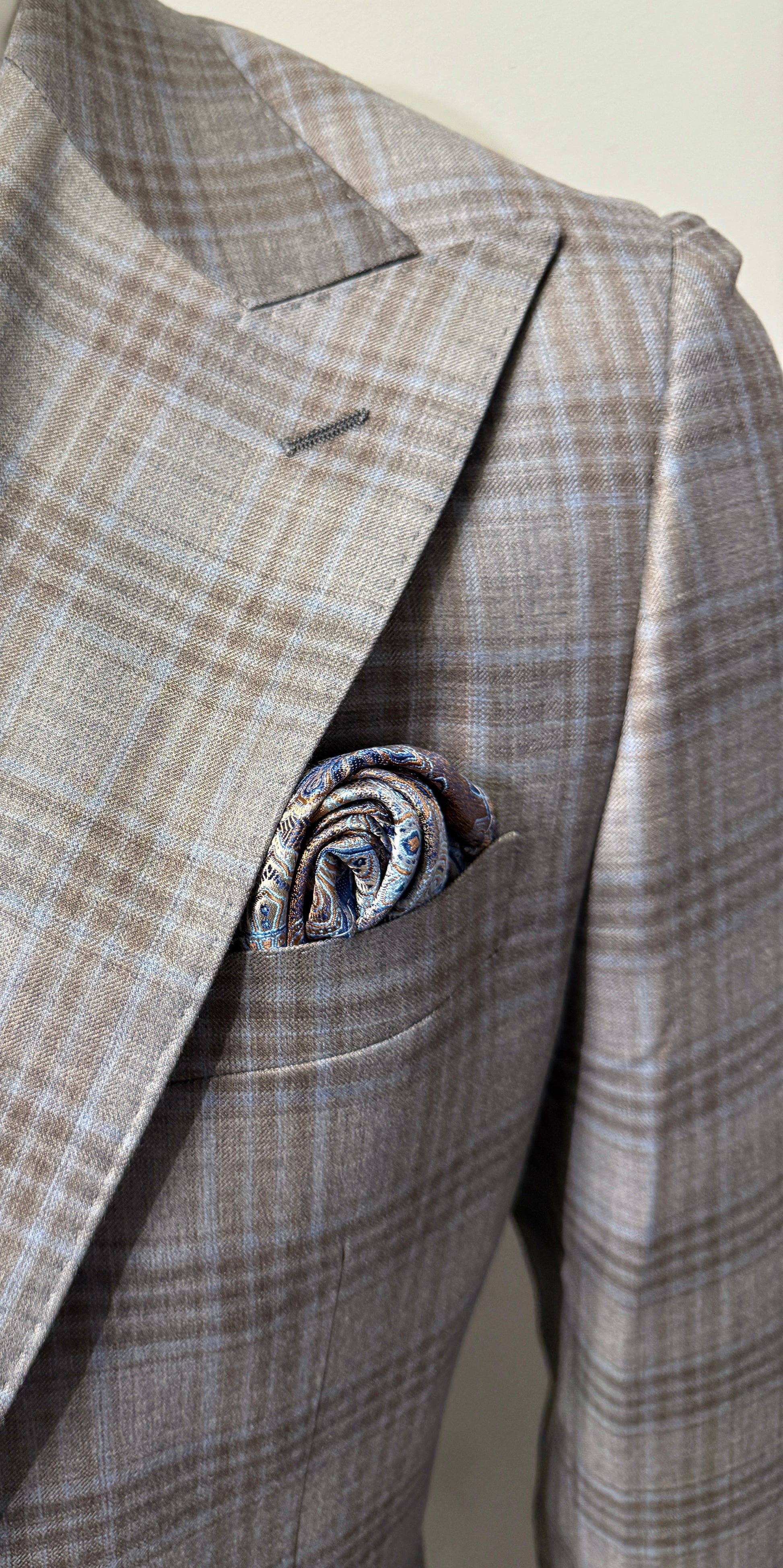 A man wears a Tiglio Rosso Orvietto Grey/Brown/Blue Plaid Semi Wide Leg suit (TL9339), standing forward against a plain white background.