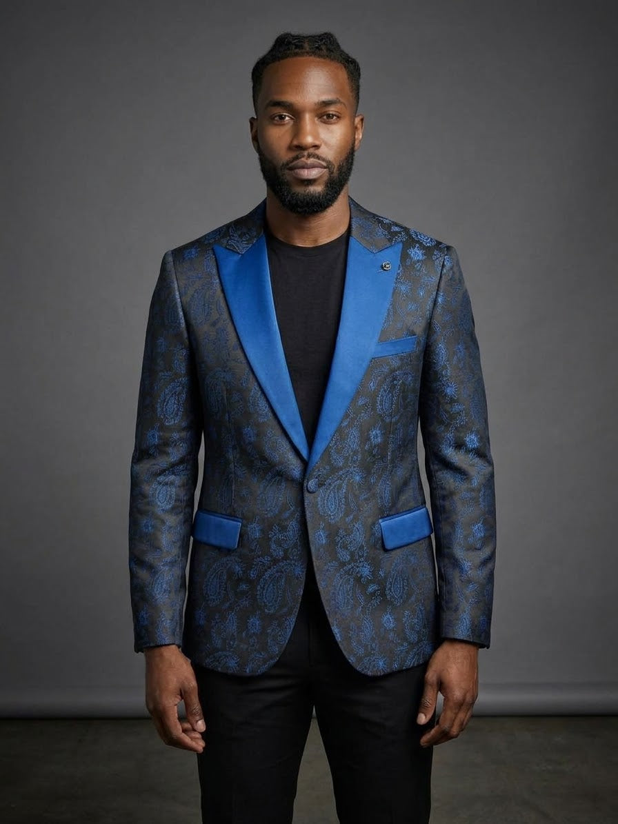 A man wears the EJ SAMUEL Jacket 27 Size 2XL, a blue and black patterned suit jacket over a black shirt. Final sale: no returns or exchanges.