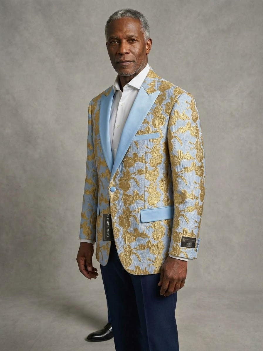 A man wears the EJ SAMUEL JACKET 5 (2XL,5XL), light blue with a gold floral pattern, over a white shirt and dark pants; final sale, no exchanges or returns.