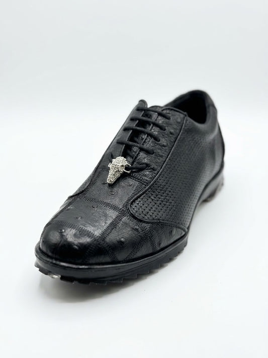 The Los Altos Avestruz Perforated Ostrich Lace Up Casuals in Black feature a textured black leather upper reminiscent of exotic skin, detailed with laces and a metallic bull head ornament near the tongue, presented against a plain white background.