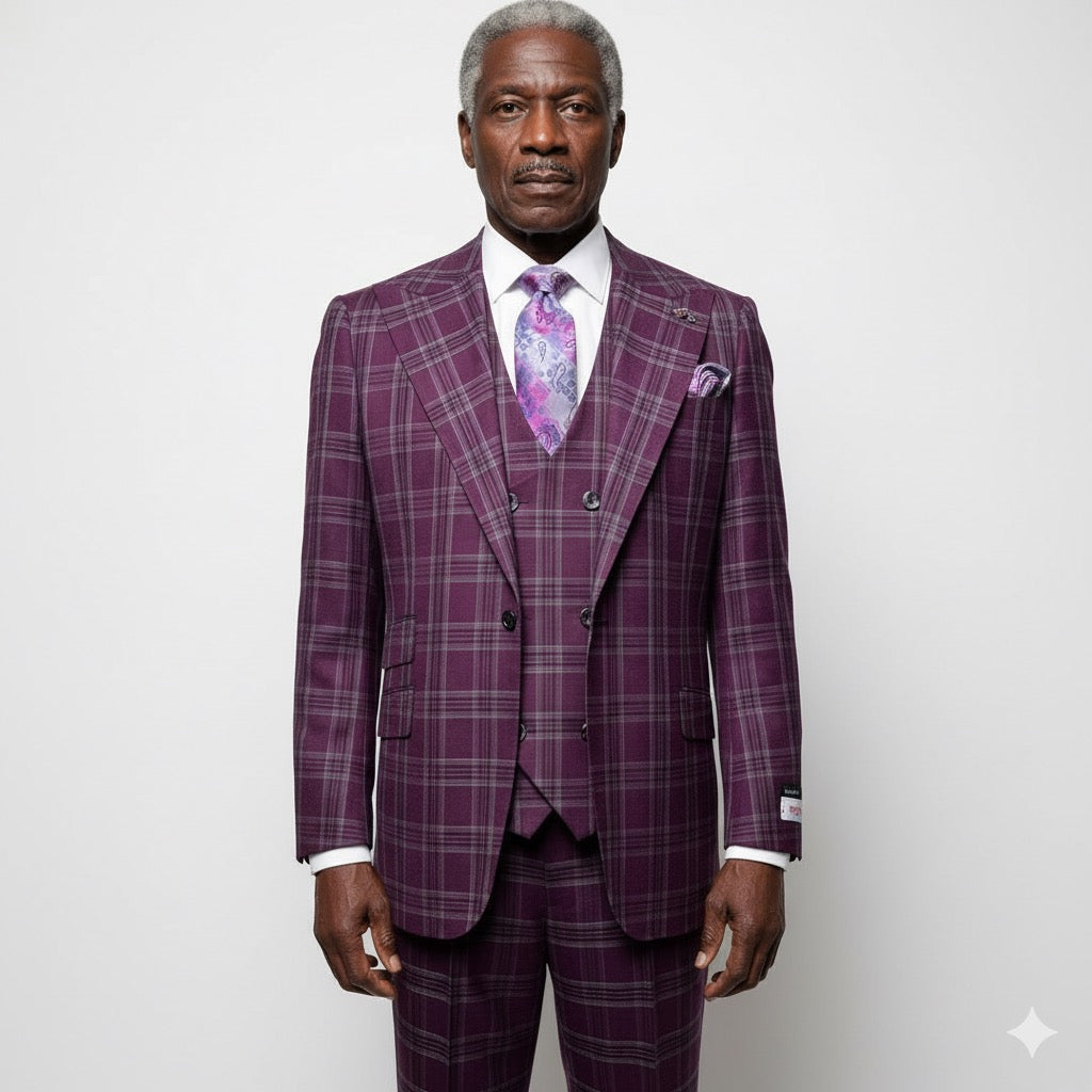 An older man stands against a plain background, wearing the Tiglio Rosso Orvietto Burgundy / Grey TL6336 suit with a matching vest, white shirt, and floral tie, showcasing the classic wide leg fit typical of Tiglio Rosso.