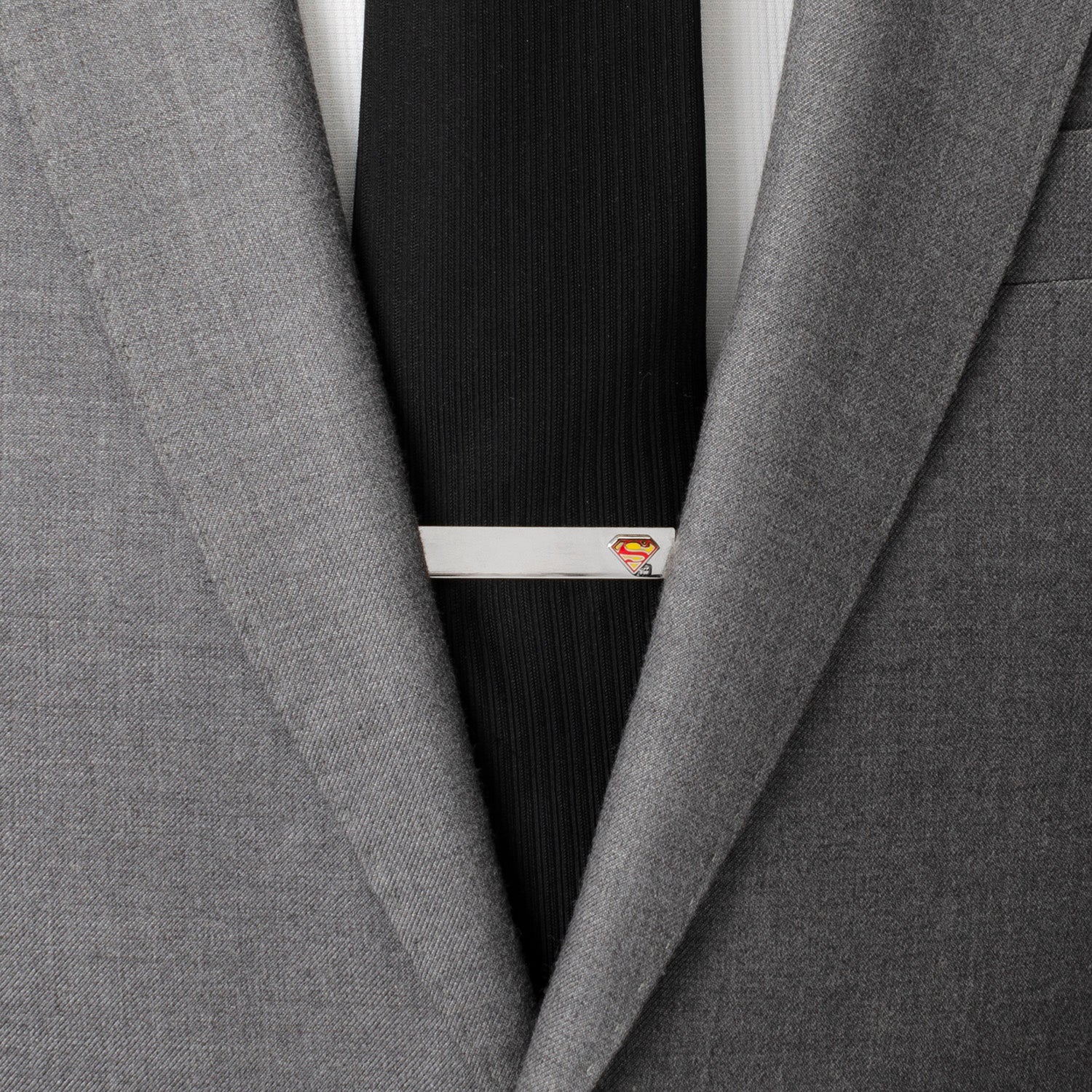 Add hero flair to your look with the DC Superman Hidden Message Silver Tie Bar by Cufflinks.com—featuring the iconic red and yellow logo and an engraving of "Truth, Justice, and the American Way." Perfect for any DC Comics fan.