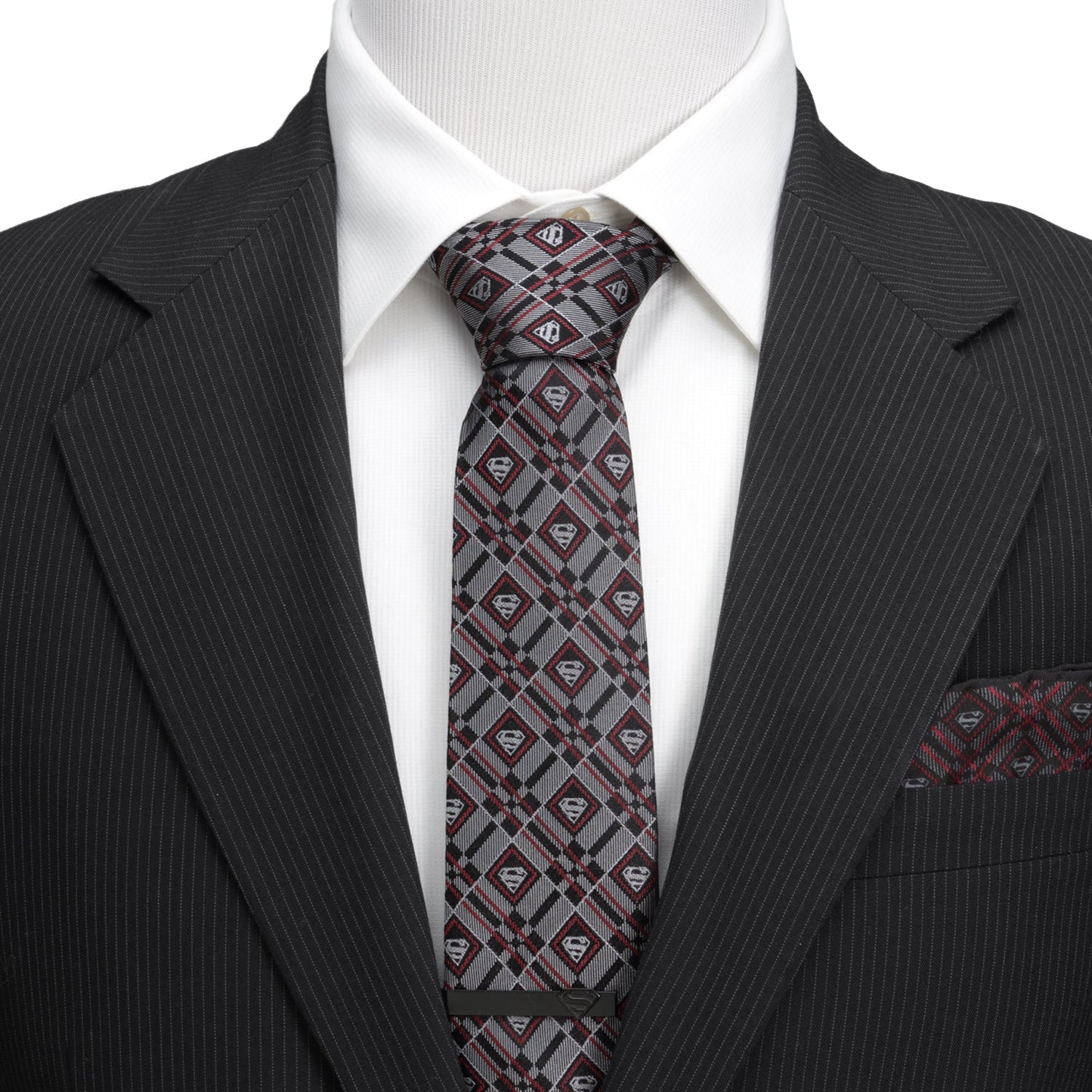 The DC Superman Geometric Gray Silk Men's Tie by Cufflinks.com is a rolled-up silk tie featuring a geometric plaid pattern with diamond-shaped accents in gray.