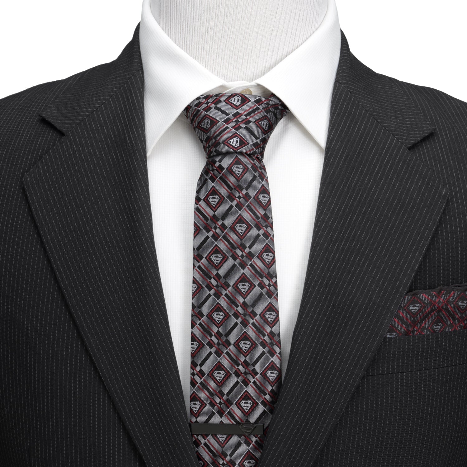 The DC Superman Geometric Gray Silk Men's Tie by Cufflinks.com is a rolled-up silk tie featuring a geometric plaid pattern with diamond-shaped accents in gray.