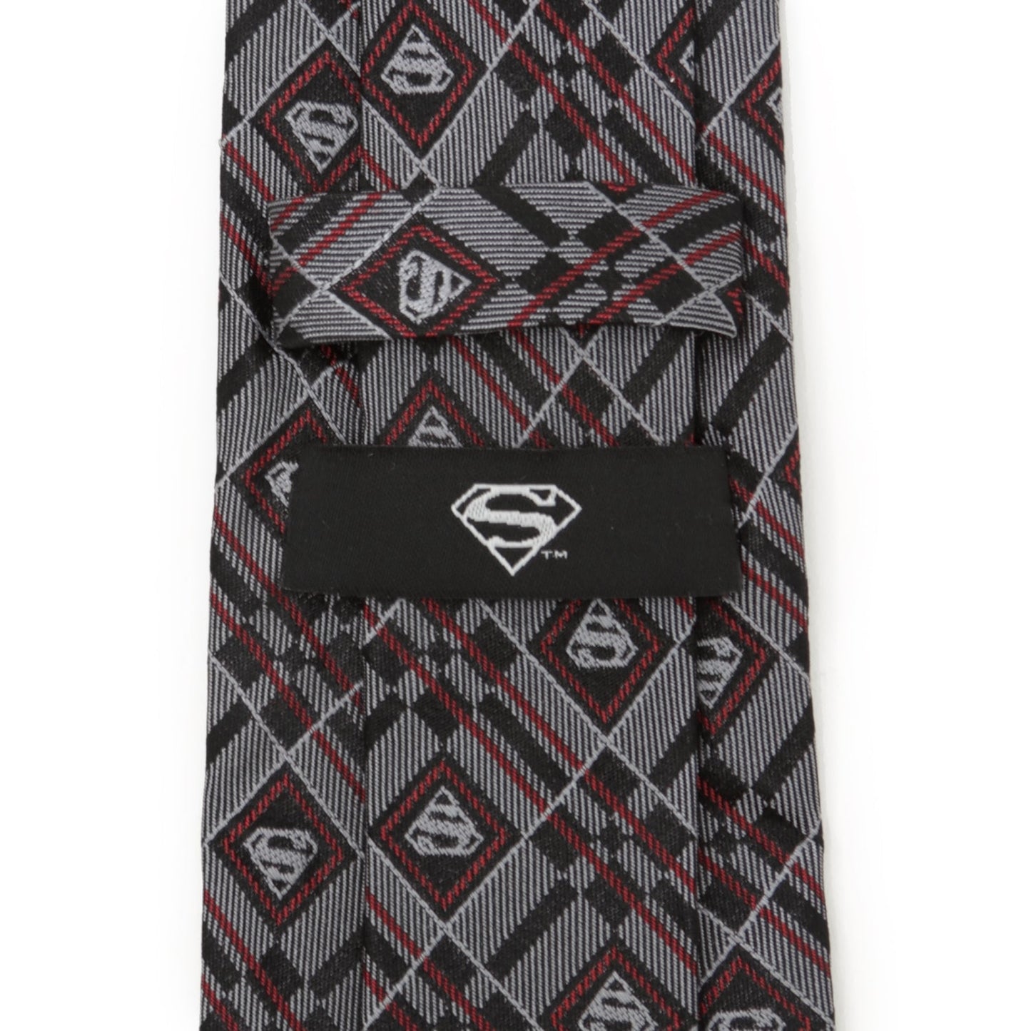 The DC Superman Geometric Gray Silk Men's Tie by Cufflinks.com is a rolled-up silk tie featuring a geometric plaid pattern with diamond-shaped accents in gray.