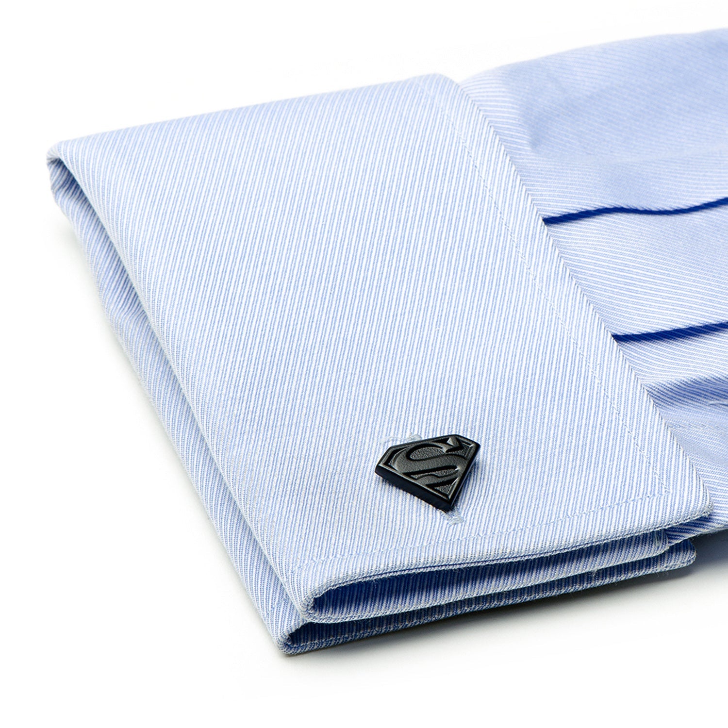 The DC Superman Shield Satin Black Cufflinks by Cufflinks.com feature one cufflink with the iconic Superman "S" shield and the other with the classic DC logo, both in a sleek black finish.