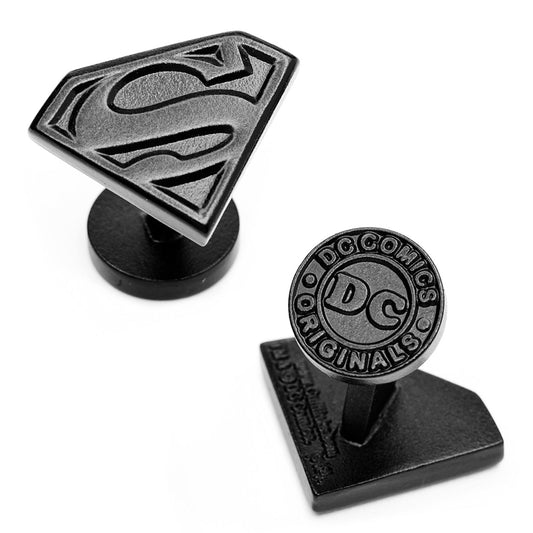 The DC Superman Shield Satin Black Cufflinks by Cufflinks.com feature one cufflink with the iconic Superman "S" shield and the other with the classic DC logo, both in a sleek black finish.