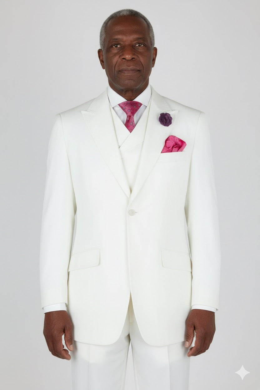 The Tiglio Rosso San Giovesse Off White tuxedo is a stunning ensemble featuring a matching vest and pink tie, pocket square, and boutonniere. Combining the refined elegance typical of three-piece suits, this tuxedo from Tiglio Rosso is perfect for making a stylish statement.