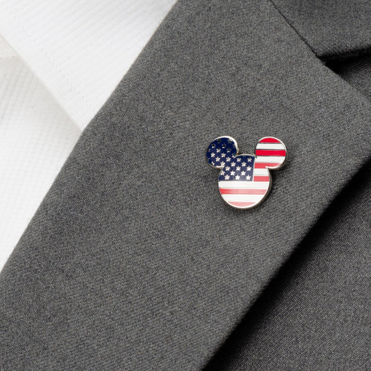 Celebrate your Disney fandom with the Disney Mickey Mouse Stars and Stripes Lapel Pin by Cufflinks.com, featuring Mickey’s head adorned with the American flag’s stars and stripes.