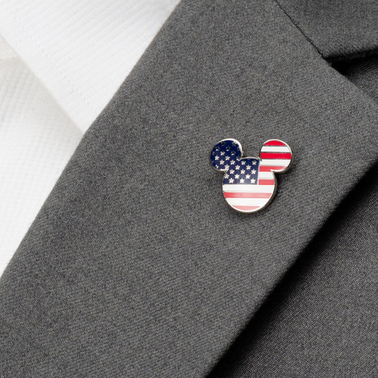 Celebrate your Disney fandom with the Disney Mickey Mouse Stars and Stripes Lapel Pin by Cufflinks.com, featuring Mickey’s head adorned with the American flag’s stars and stripes.