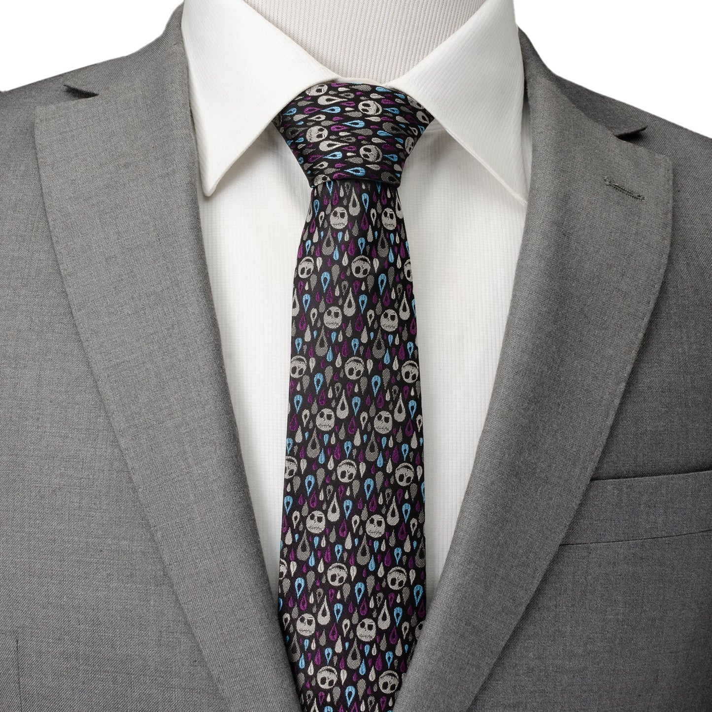 The Disney The Nightmare Before Christmas Jack Skellington Patterned Men's Tie by Cufflinks.com features a black silk blend with white skulls and blue and purple teardrops—perfect for fans seeking a unique accessory.