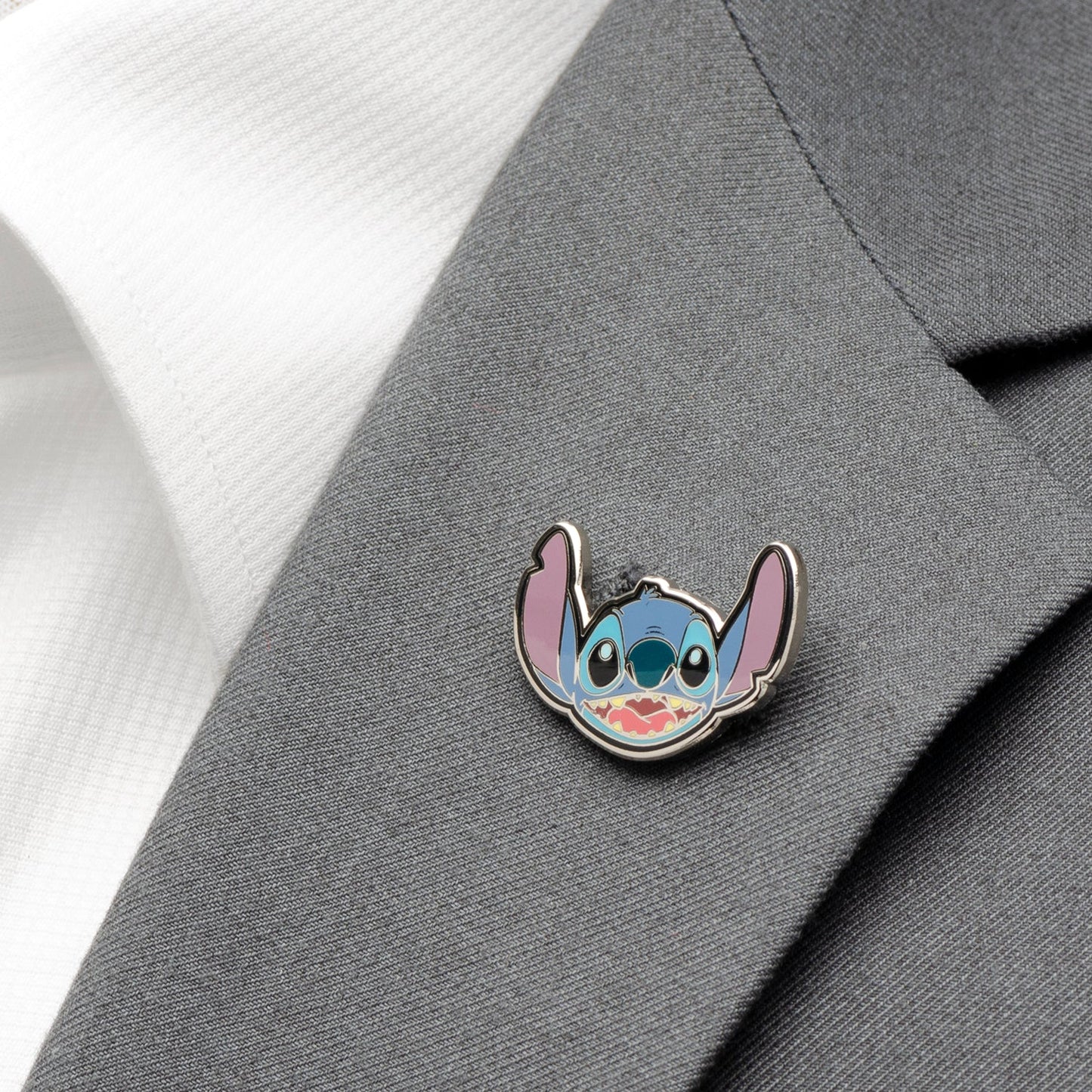 The Disney Lilo & Stitch Gift Set from Cufflinks.com includes a light grey tie with a Stitch pattern and an enamel pin of Stitch’s face—an ideal officially licensed gift for "Lilo & Stitch" fans.