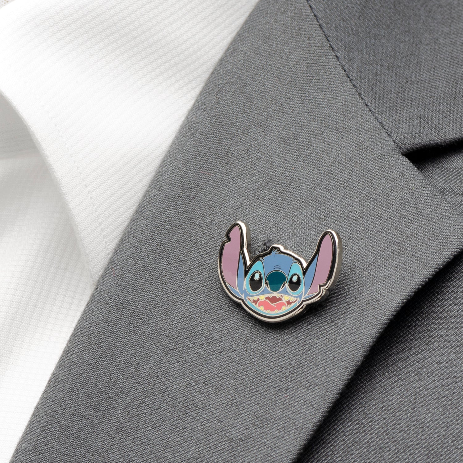 The Disney Lilo & Stitch Gift Set from Cufflinks.com includes a light grey tie with a Stitch pattern and an enamel pin of Stitch’s face—an ideal officially licensed gift for "Lilo & Stitch" fans.
