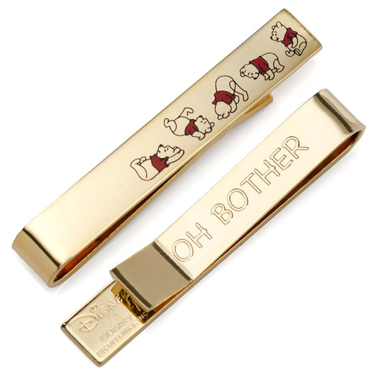The Disney Winnie the Pooh Hidden Message Tie Bar by Cufflinks.com features gold designs: one displays Winnie the Pooh in multiple poses, the other is engraved with "OH BOTHER." A perfect accessory for classic Winnie the Pooh fans.